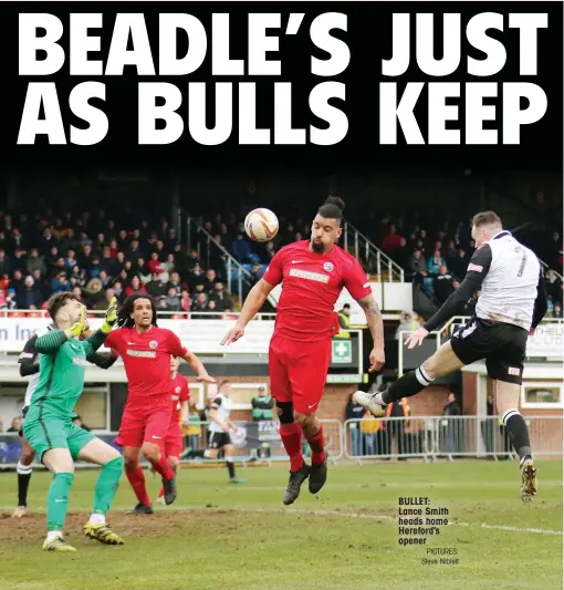  ?? PICTURES: Steve Niblett ?? BULLET: Lance Smith heads home Hereford’s opener