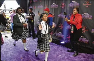  ?? HYOSUB SHIN PHOTOS / HSHIN@AJC.COM ?? More than 700 DeKalb County School District and Atlanta Public Schools students Tuesday got a redcarpet greeting while attending a private viewing of “Black Panther” — put on by Bailey’s Phoenix Leadership Foundation, Movie Tavern in Tucker, the DeKalb...