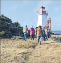 ?? GREG MCNEIL/CAPE BRETON POST ?? Many members of the village of Gabarus were on hand to watch the move of their lighthouse to safer ground on Friday.