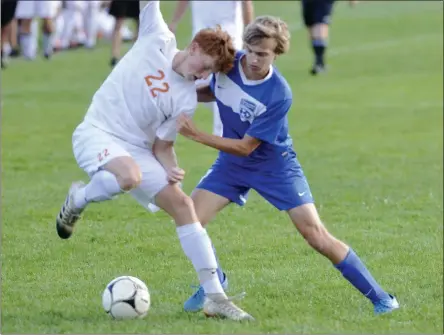  ?? STAN HUDY/THE SARATOGIAN ?? Saraotga Springs senior Michael Masten looks to push Bethlehem’s Aidan Jones off the ball during the second half of play during Tuesday’s Suburban Councol contest at Saratoga Springs High School.