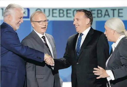  ?? ALLEN McINNIS ?? Party leaders, from left: Philippe Couillard, Jean-François Lisée, François Legault and Manon Massé pose for photos before the start of Monday’s English-language debate at the Maison Radio-Canada. All four parties voted in favour of a resolution discouragi­ng “Bonjour-Hi” in 2017.