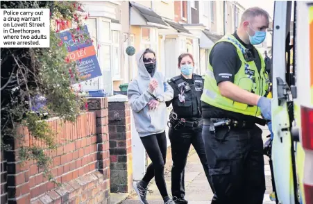  ??  ?? Police carry out a drug warrant on Lovett Street in Cleethorpe­s where two adults were arrested.