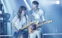  ?? ?? Jenny Lewis, left, and Ben Gibbard of the Postal Service play the band’s first Milwaukee
concert in 21 years Monday
night at a sold-out Miller High Life Theatre.