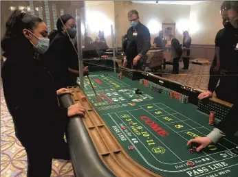  ?? JERRY DAVICH/POST-TRIBUNE PHOTOS ?? New dealer trainees learn the game of craps during their second week of a 10-week training program inside the pavilion of Majestic Star in Gary. They are among 70 who are preparing to work at the Hard Rock Casino Northern Indiana.