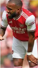  ??  ?? Sore: Lacazette looks to the Arsenal bench