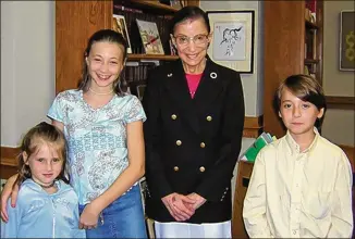  ?? CONTRIBUTE­D ?? Naomi Shavin (second from left) wrote to Supreme Court Justice Ruth Bader Ginsburg at age 5, and in 2003, when she was 12, she and her siblings met her role model (and pen pal) in her chambers.