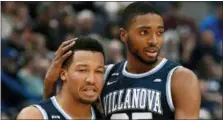  ??  ?? Villanova’s Jalen Brunson, left, is embraced by teammate Mikal Bridges during the second half of an NCAA college basketball game against Connecticu­t, in Hartford, Conn. Brunson, The Associated Press men’s college basketball player of the year, has...