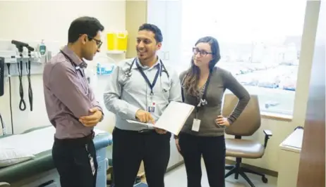  ?? Photo: Brian Hamilton ?? Medical residents (from left) Salman Al-Hawshani, Suleiman Furmli and Carolyn Arbanas prepare for their rounds.