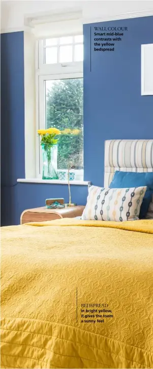  ??  ?? WALL COLOUR Smart mid-blue contrasts with the yellow bedspread BEDSPREAD In bright yellow, it gives the room a sunny feel