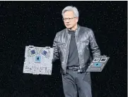  ?? BLOOMBERG ?? Jensen Huang, co-founder and CEO of Nvidia, shows the new Blackwell GPU chip at a company event in San Jose, California, on March 18.