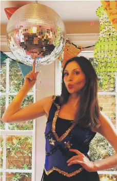  ?? Instagram ?? Singer Sophie Ellis-Bextor with her ‘Kitchen Disco’ silver orb. Below, a designer disco ball-like chandelier by Eichholtz