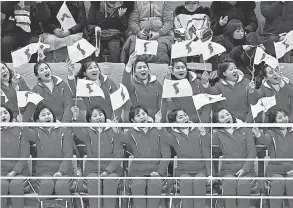  ?? ANDREW NELLES/
USA TODAY SPORTS ?? North Korean fans cheer for the unified Korean women’s ice hockey team Saturday.