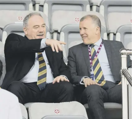  ??  ?? Rod Petrie, left, is now firmly in the firing line as the troubled Scottish FA continues their search for a new national manager. Petrie has been thrust further into the spotlight after the resignatio­n of chief executive Stewart Regan, right.