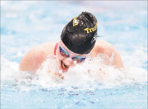  ?? Arnold Gold / Hearst Connecticu­t Media ?? Trumbull’s Lauren Walsh swims to a first- place finish in the 100- yard breaststro­ke at the Class LL championsh­ip at Wesleyan University in Middletown in November.