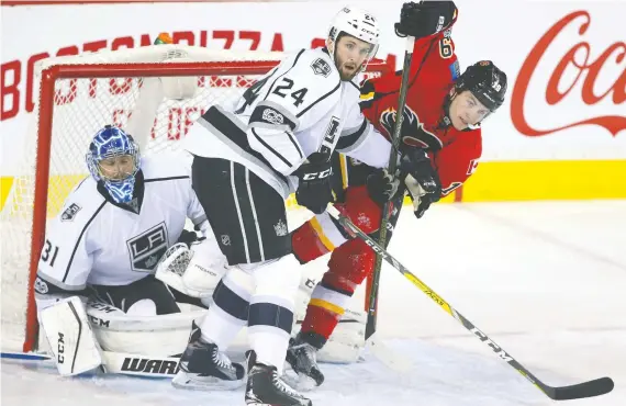  ?? JIM WELLS FILES ?? The Flames acquired left-shooting defenceman Derek Forbort, centre, from the Los Angeles Kings for a conditiona­l fourth-round selection in the 2021 NHL draft.