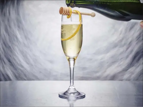  ?? PHIL MANSFIELD — THE CULINARY INSTITUTE OF AMERICA VIA AP ?? Kindness sparkling wine is a mix of botanical gin, lightly spiced Drambuie and the complex sweetness of honey, all topped off with the requisite New Year’s Eve bubbles.