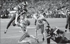  ?? AP/STEPHEN BRASHEAR ?? Seattle Seahawks running back J.D. McKissic (Arkansas State University) goes airborne as he gets closer to the goal line in the Seahawks’ 38-31 victory over the Kansas City Chiefs on Sunday night. McKissic rushed for 6 yards on one carry in a victory that allowed the Seahawks to secure a playoff berth.