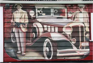  ??  ?? The mural on the wall of Nigel Fraser’s Classic Auto Repaints in Opunake