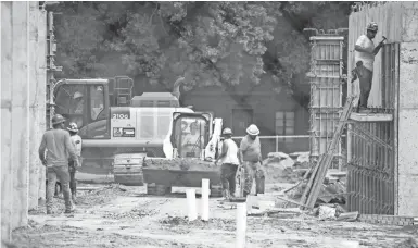  ??  ?? Constructi­on continues on the Poplar Arts Lofts, Aug. 26.