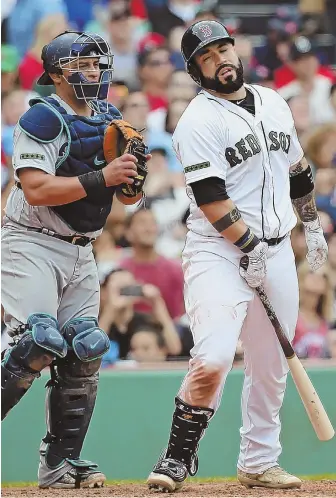  ?? STAFF PHOTO BY NANCY LANE ?? NO OFFENSE: Sandy Leon reacts after hitting an infield popup during the eighth inning of the Sox' loss to the Mariners yesterday at Fenway.