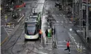  ??  ?? People wear face masks in Melbourne on Sunday. Photograph: James Ross/AAP