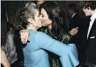  ??  ?? Actors Frances McDormand, left, kisses up to Catherine Keener.