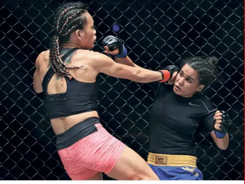  ?? GETTY IMAGES ?? Women of spunk: India’s female fighters have treaded an obscure walkway before two seasoned athletes, Puja Tomar (above, right) and Priya Sharma (right) forged their spotlight.