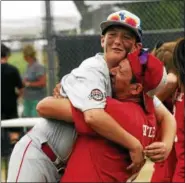  ??  ?? Spring Renegade first baseman Eddie Girtler gets a bear hug from his father after winning the Mid-Atlantic Regional and earning a berth in the 12U Cal RIpken World Series in Branson, Missouri.