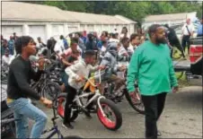  ?? KATHLEEN CAREY — DIGITAL FIRST MEDIA ?? Robert Powell, father of 14-year-old Zenas “Nas” Powell who was gunned down in May, walks along the path of the “Rideout for Peace” in memory of his son and all those impacted by violence in the city.