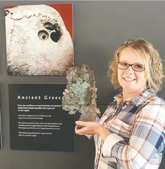  ?? HANDOUT ?? Diane Mitchell shows a sample of oxidized native copper ore, part of the Britannia Mine Museum’s summer exhibit Copper: Bug Buster, which launches July 18.