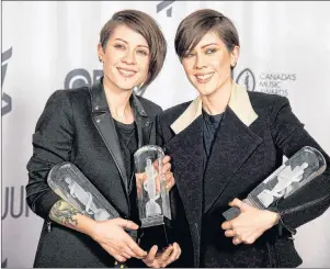  ?? CP PHOTO ?? Tegan and Sara celebrate their three Juno Awards for Pop Album of the Year, Group of the Year and Single of the Year during the Junos in Winnipeg in March 2014.