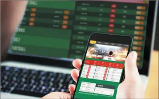  ??  ?? New technology has made gambling so accessible that young people see it as the norm, betting on everything from football games to horse racing, as a way to pass the time.