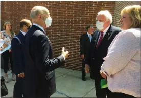  ?? EVAN BRANDT — MEDIANEWS GROUP ?? Gov. Tom Wolf, left, chats with state Reps. Tim Hennessey, R-26th Dist. and Tracy Pennycuik, R-147th Dist., before Wednesday’s press conference.