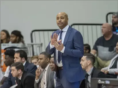  ?? JOHN BLAINE — FOR THE TRENTONIAN ?? Rider coach Kevin Baggett claps his hands during a MAAC game against Siena last season.