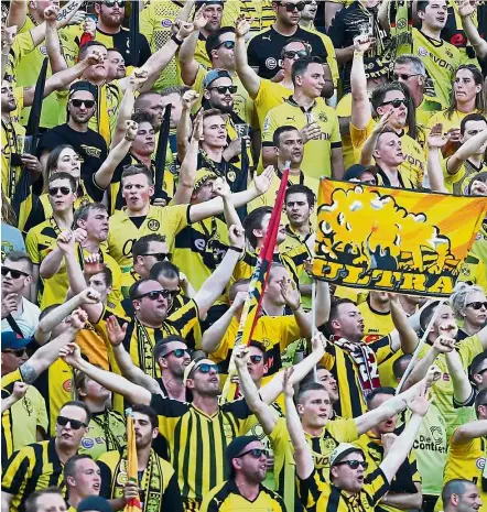  ?? Reuters ?? Standing room only: Borussia Dortmund’s Signal Iduna Stadium has a standing tribune for 25,000 fans. —