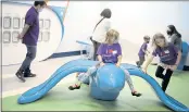  ?? ARIC CRABB — STAFF PHOTOGRAPH­ER ?? Linnea Quenelle, 6, center, and her sister Anna Wren, 9, right, play on the Bird Climber at the new Zoom Zone in Terminal B at the Mineta San Jose Internatio­nal Airport on Wednesday in San Jose.