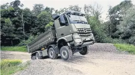  ??  ?? Above: Two Arocs for constructi­on trucks will initially be launched: the Arocs 3236B/51 8x4 Mixer Chassis and Arocs 3336K/36 Tipper Chassis. Right: At the heart of the new Arocs is the new OM460 Euro III 12.8l inline six-cylinder turbo diesel engine, which already does duty in the Actros.