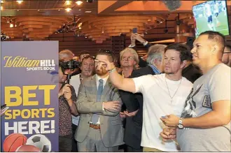  ??  ?? Where Eagles dare: movie star Mark Wahlberg, second right, set the ball rolling at the Ocean Casino