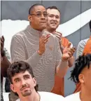  ?? AARON E. MARTINEZ/AMERICAN-STATESMAN ?? Texas men’s basketball coach Rodney Terry applauds as the Longhorns are announced as a No. 7 seed during the Selection Sunday TV broadcast. They’ll open up their NCAA Tournament on Thursday against the winner of Tuesday night’s Virginia-Colorado State game.