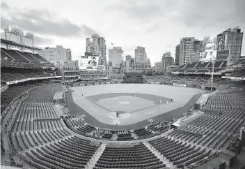  ?? K.C. ALFRED U-T ?? The Padres finally opened the season against the Arizona Diamondbac­ks on July 24 with no fans in attendance at Petco Park. Fans are hopeful that vaccines will pave the way to attend games next season.