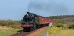  ?? JAMES KINDRED ?? Recalling its days on the former London, Tilbury & Southend route commuter trains, visiting ‘4MT’ No. 80072 crosses Bridge 303 with the North Norfolk Railway’s BR suburban set in tow at the line’s ‘Spring Steam Gala’ on April 22.