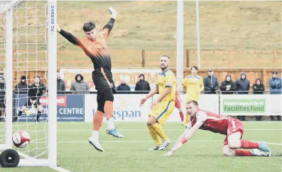  ??  ?? James Walshaw finds the bottom corner of the Radcliffe net during Boro’s 5-1 home victory Pictures by Morgan Exley