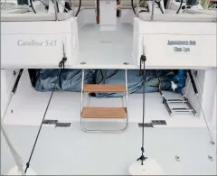  ??  ?? As proved in the 2020 Boat of the Year competitio­n, dropdown transoms and dinghy garages are now “a thing.” The Bavaria C57 (left) includes space for life-raft stowage. The Catalina 545 (right) has an integral ladder to the cockpit.