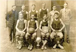  ?? COURTESY ?? The 1922 Loyola High School basketball team went 19-0 and won one game by a score of 162-4. Sitting, from left, are Jack Cummings Sr., Bob Rosensteel, Ray Helfrich and Jim Lacy Sr. Standing, from left, are Coach Bill Schuerholz, Jerry O’Malley, Rob Lyon, Ivan Carmody, Jack Menton and Edward Milholland.