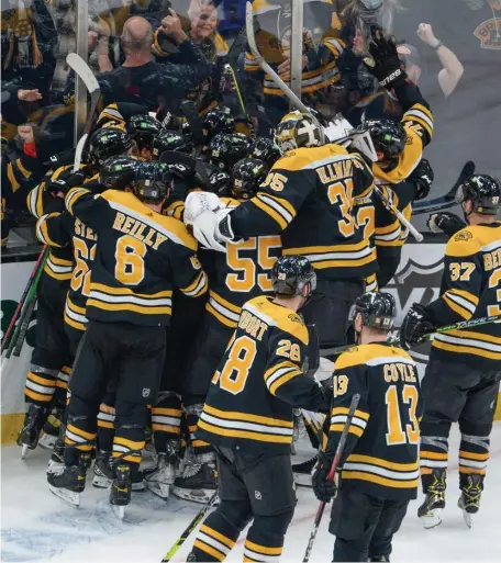  ?? JiM MAHONEY / BOSTON HErALD ?? PARTY TIME: The Bruins celebrate after Taylor Hall’s overtime winner against the Nashville Predators on Saturday at TD Garden.