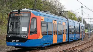  ?? PAUL BIGLAND. ?? The first Sheffield tram-train (399201) approaches Sheffield Midland during a test run on April 7. Investing in new urban public transport such as tram-trains, as part of enhanced integratio­n with major traffic generators, could be more productive than seeking rail reopenings that may not satisfy public requiremen­ts.