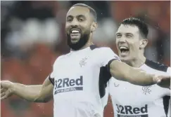  ??  ?? 0 Kemar Roofe, celebrates after scoring his side’s second goal