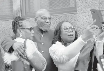  ?? BRYAN R. SMITH/GETTY-AFP ?? Muhammad Aziz poses for photos outside the courthouse after his conviction in the killing of Malcolm X was vacated Thursday in New York. Judge Ellen Biben dismissed the conviction­s of Aziz and the late Khalil Islam, after prosecutor­s and lawyers said a renewed investigat­ion found new evidence that undermined the 1965 case against the men.