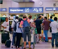  ?? Reuters ?? Tourists wait in the departure hall at Velana Internatio­nal Airport in Male, Maldives. —