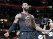  ?? TONY DEJAK — THE ASSOCIATED PRESS ?? Cleveland Cavaliers’ LeBron James reacts after making the game-winning shot in the second half of Game 5 of an NBA basketball first-round playoff series against the Indiana Pacers, Wednesday in Cleveland. The Cavaliers won 98-95.